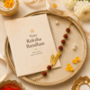 Premium Mor Pankh Rakhi With Brass Name Plate Premium Mor Pankh Rakhi With Brass Name Plate